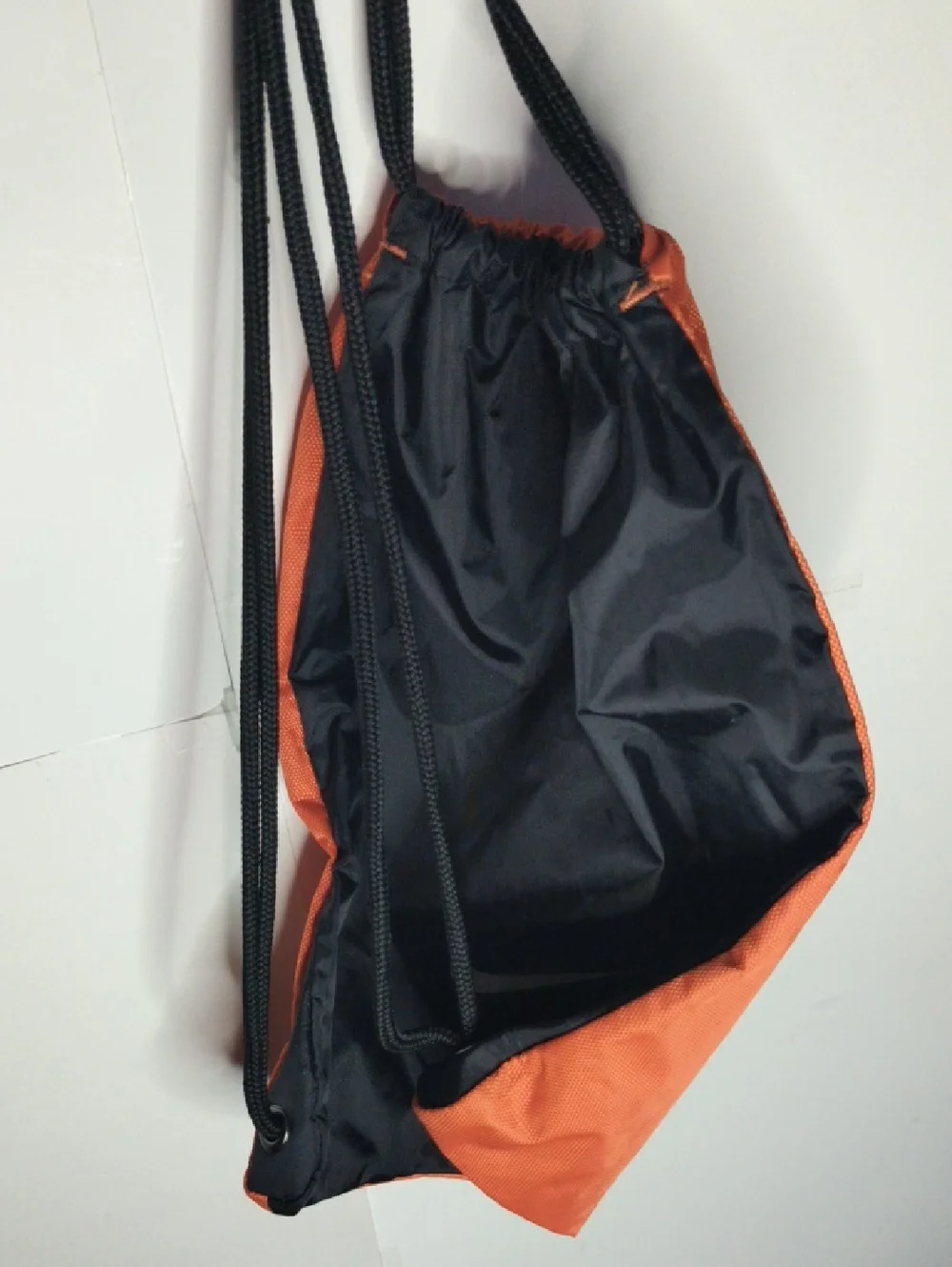 Nike Orange And Black Reversible Drawstring Backpack with White Swoosh